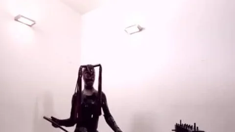 lady-man In Latex pokes Her slave lad
